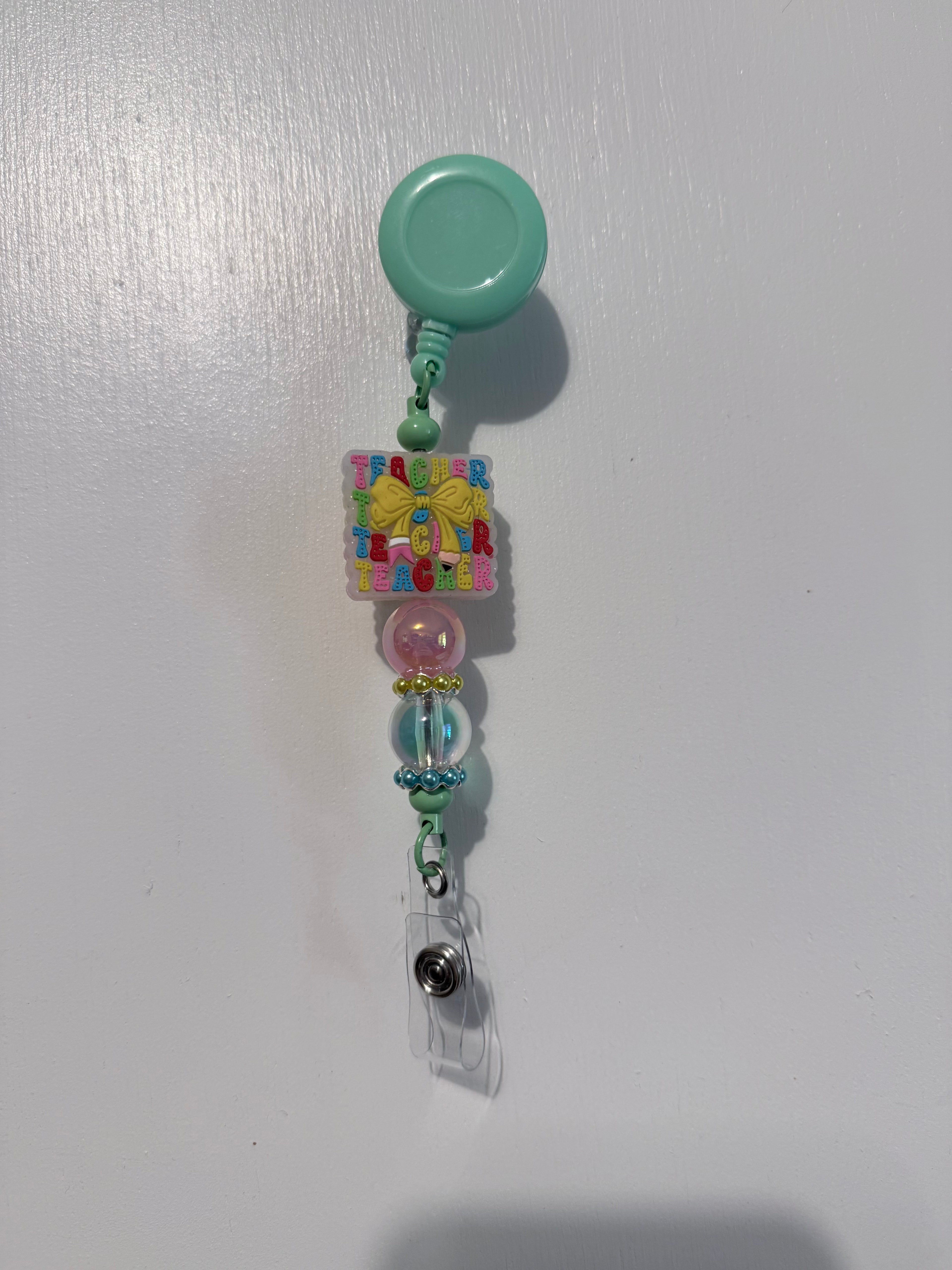 Teacher badge reel